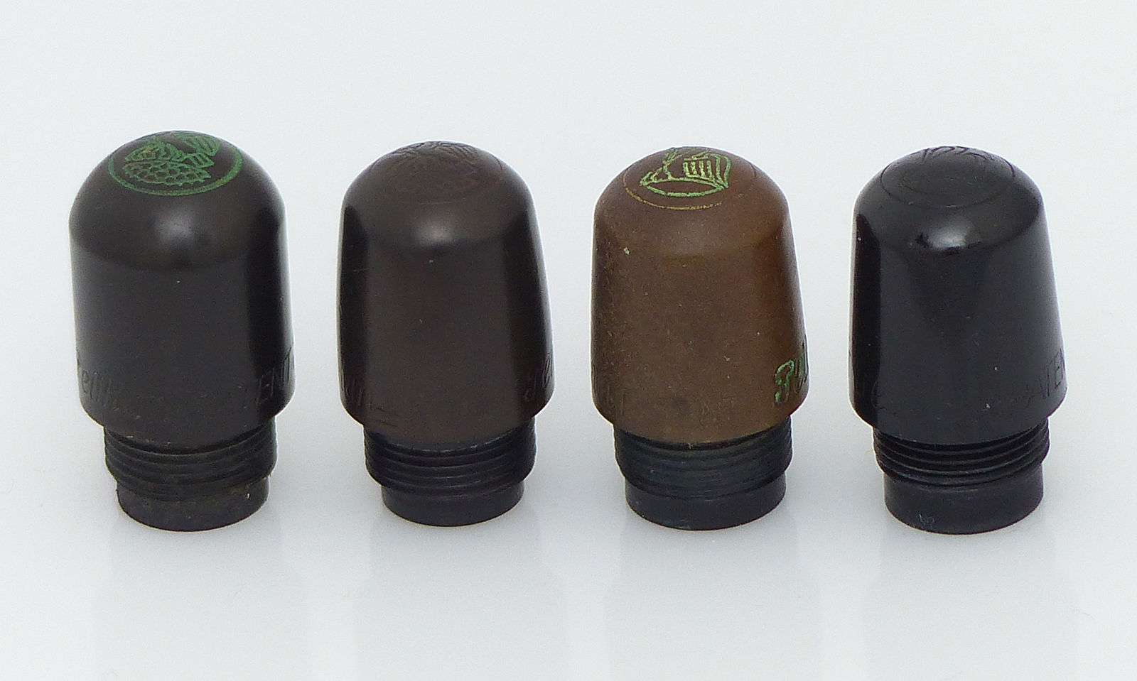 Cylindrical cap head with old logo, conical with old logo, with new logo and injection molding with new logo.